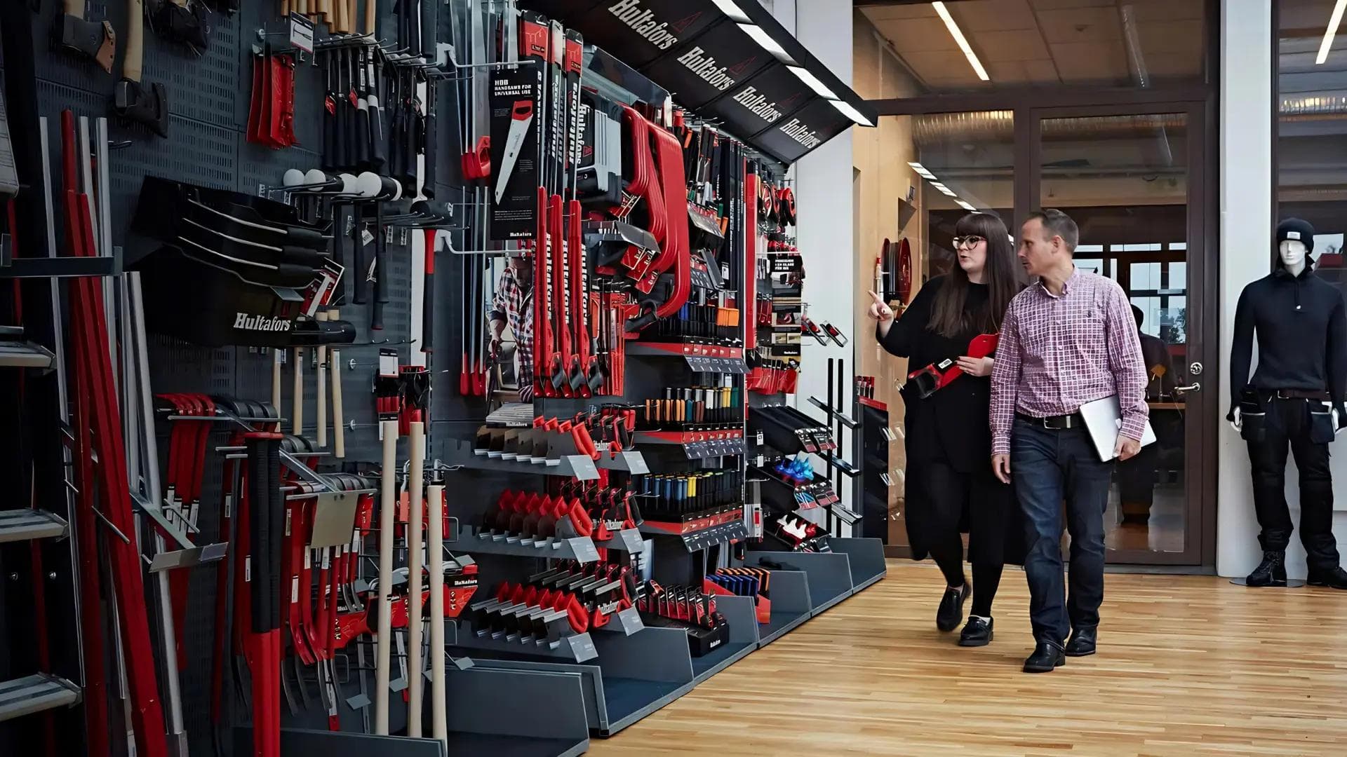 Two people looking at work tools